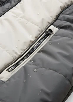 Abrigo corto para exteriores con pelo sintético y material impermeable