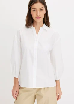 Blusa asimétrica con mangas abullonadas