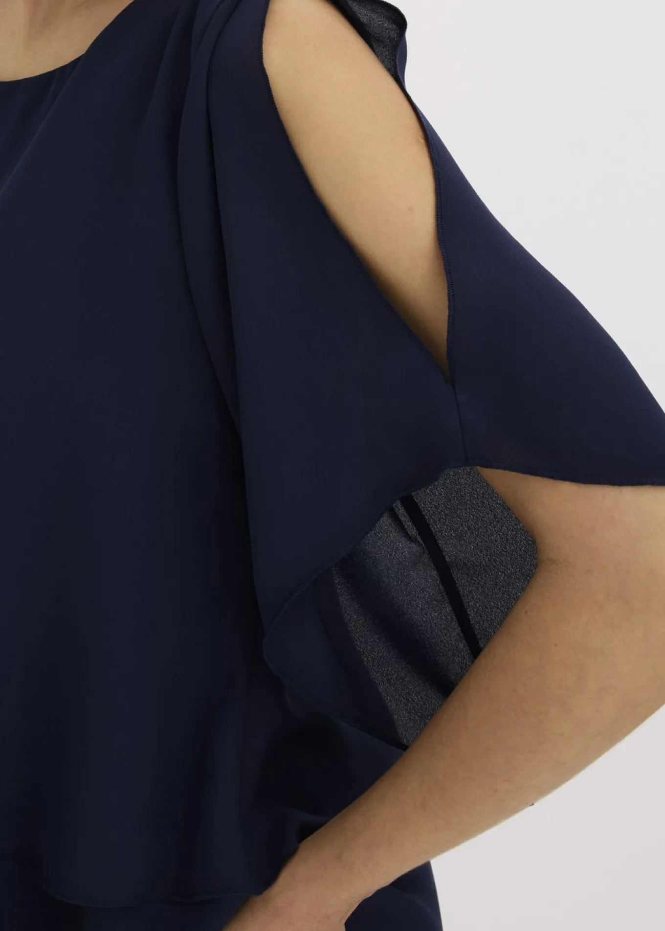 Blusa con cremallera con aspecto de capas