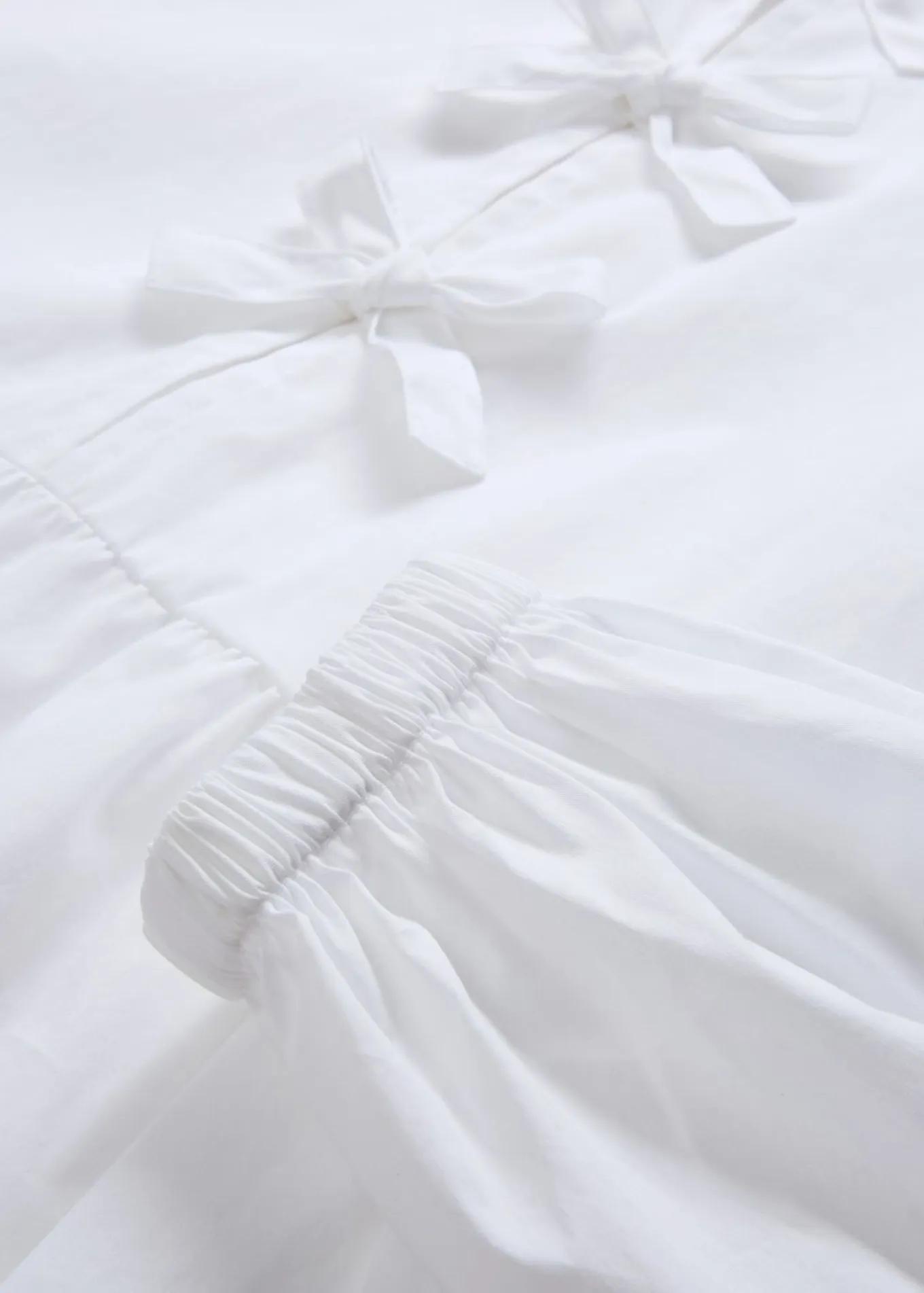 Blusa con detalles de lazo