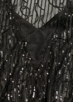 Blusa con lentejuelas y flecos