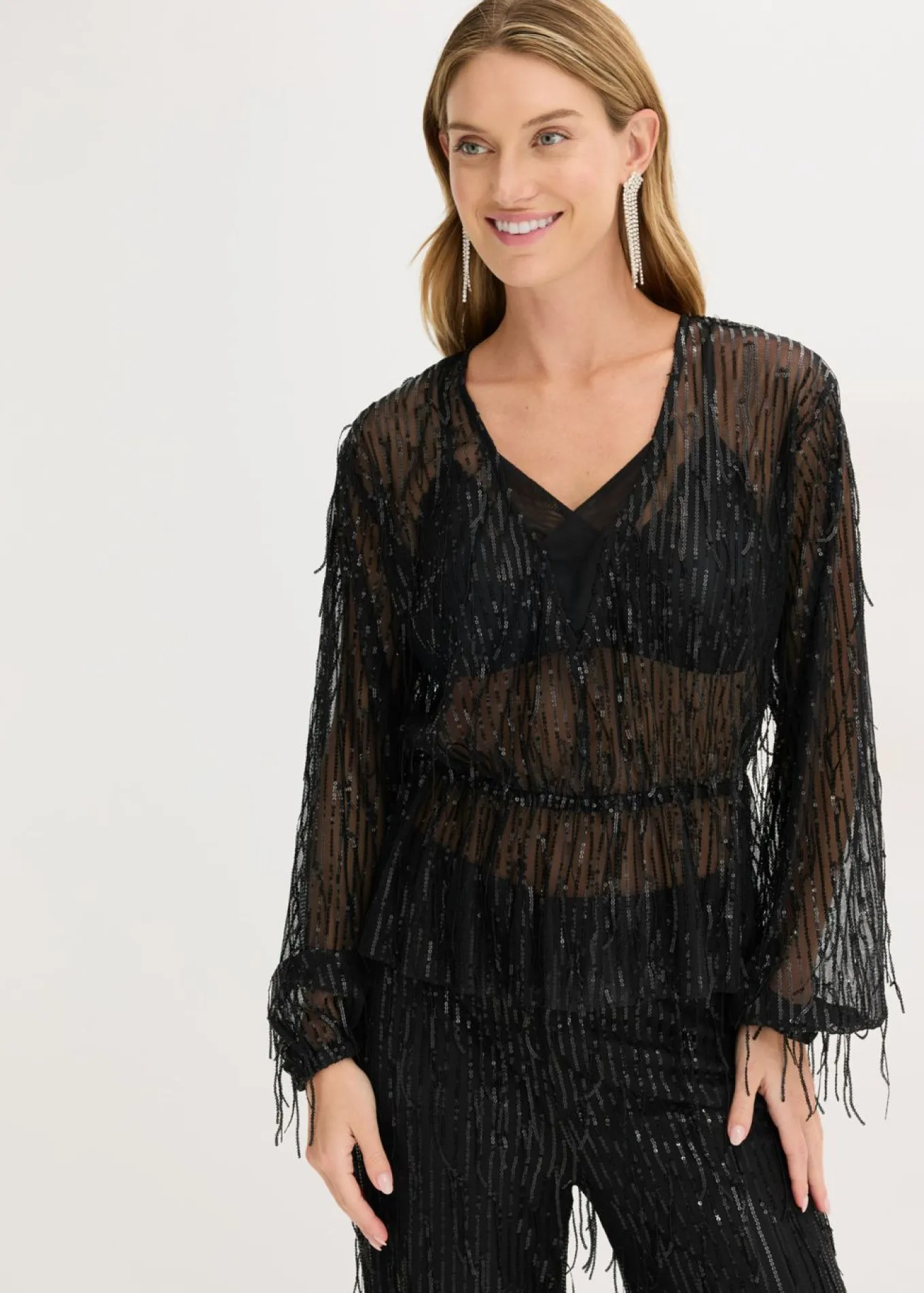 Blusa con lentejuelas y flecos
