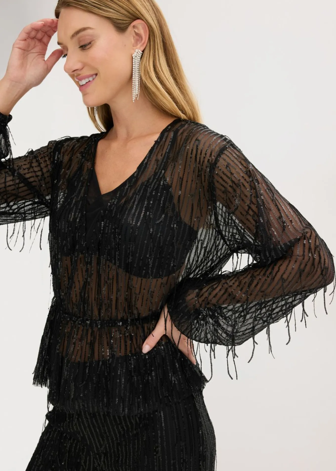 Blusa con lentejuelas y flecos