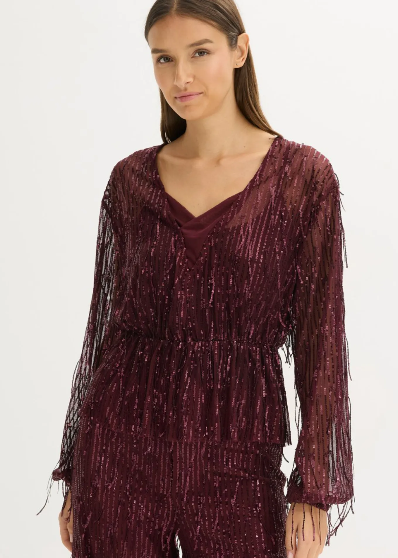 Blusa con lentejuelas y flecos