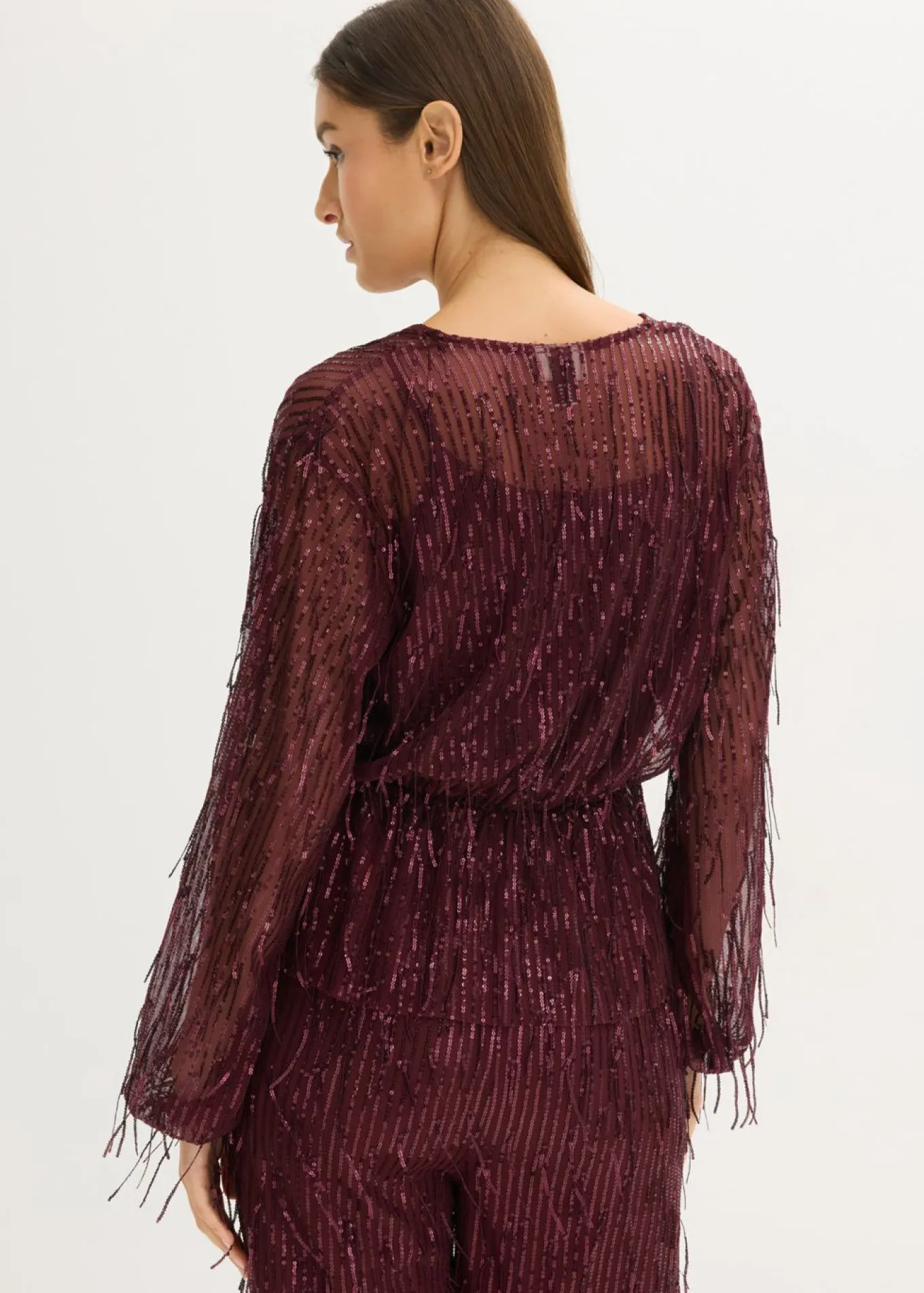Blusa con lentejuelas y flecos