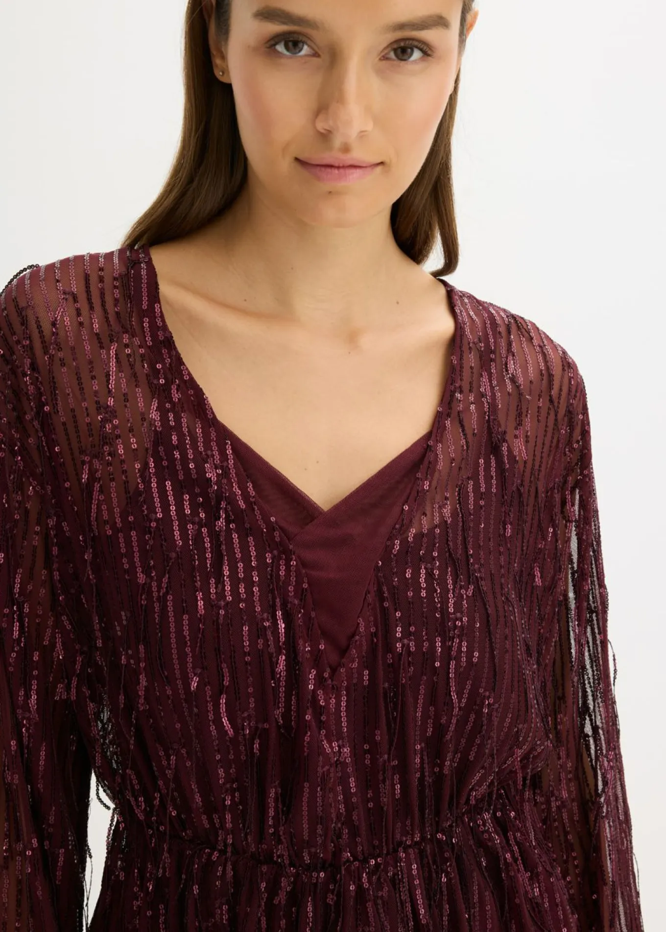 Blusa con lentejuelas y flecos
