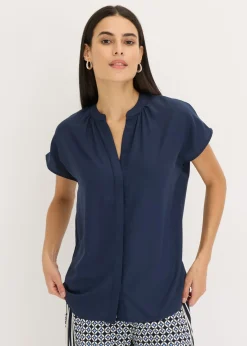 Blusa de manga corta con botones ocultos