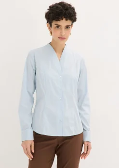 Blusa elástica de popelín con cuello chimenea y ligera transparencia