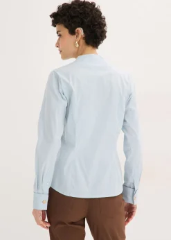Blusa elástica de popelín con cuello chimenea y ligera transparencia