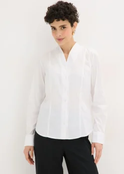 Blusa elástica de popelín con cuello chimenea y ligera transparencia