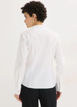 Blusa elástica de popelín con cuello chimenea y ligera transparencia