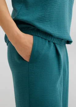 Blusa holgada con dobladillo elástico