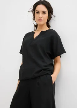 Blusa holgada con dobladillo elástico