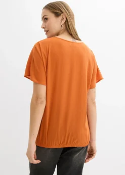 Blusa holgada con dobladillo elástico