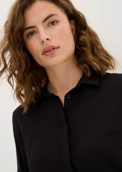 Blusa larga con abertura de viscosa fluida