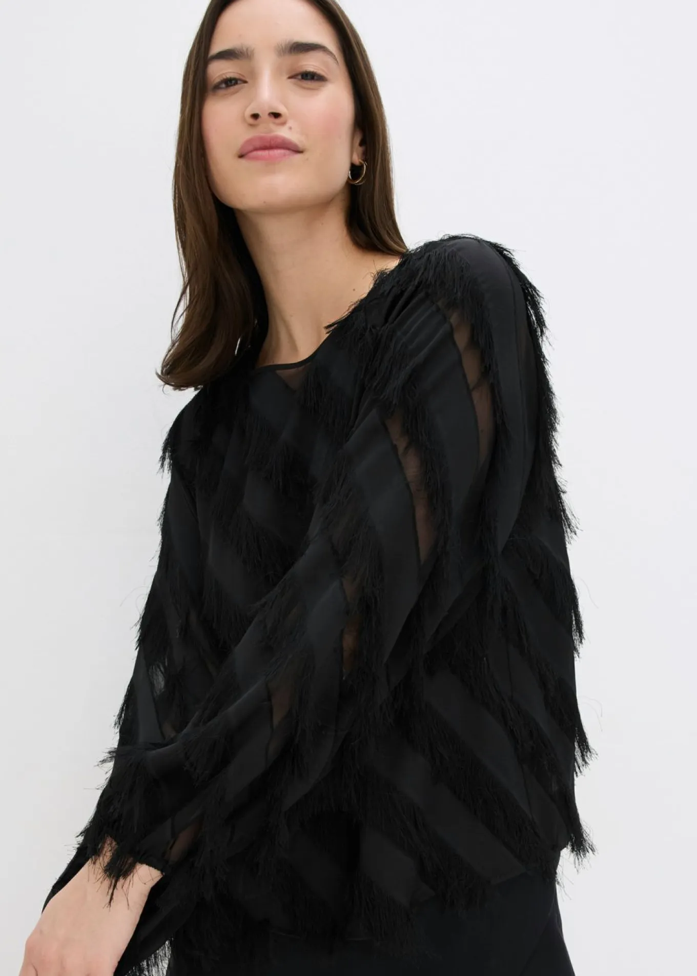 Blusa sin cierre con detalles de flecos