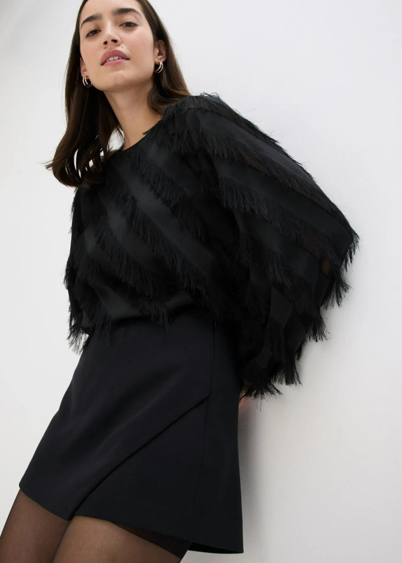 Blusa sin cierre con detalles de flecos