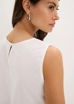 Blusa sin mangas con abertura y bordado calado