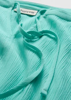 Blusa tipo túnica con mangas de murciélago