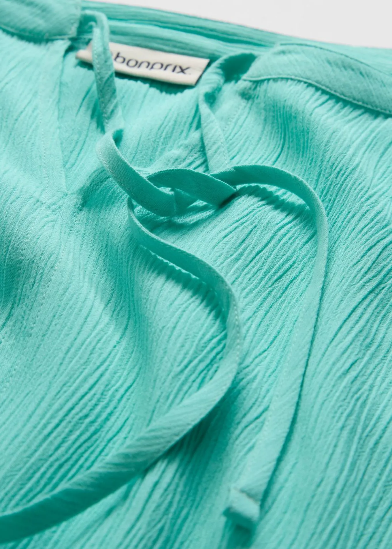 Blusa tipo túnica con mangas de murciélago