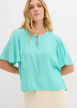 Blusa tipo túnica con mangas de murciélago
