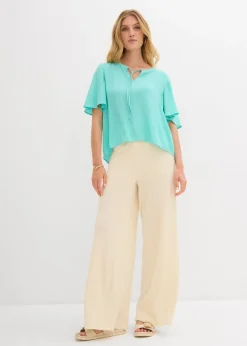 Blusa tipo túnica con mangas de murciélago