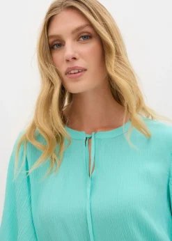 Blusa tipo túnica con mangas de murciélago