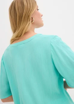 Blusa tipo túnica con mangas de murciélago