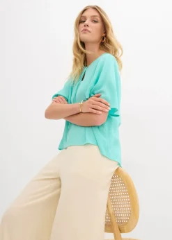Blusa tipo túnica con mangas de murciélago