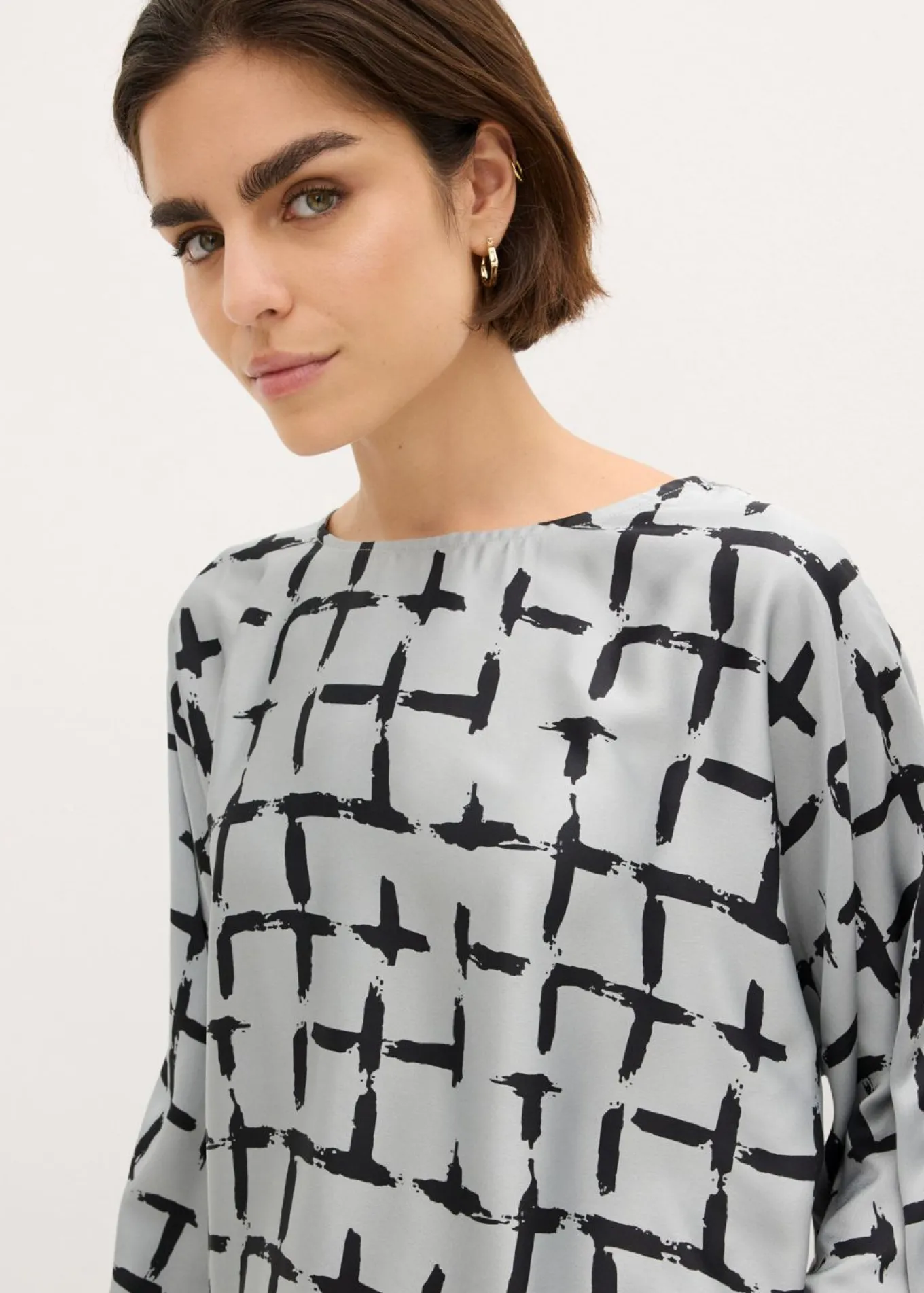 Blusa tipo túnica con mangas de murciélago