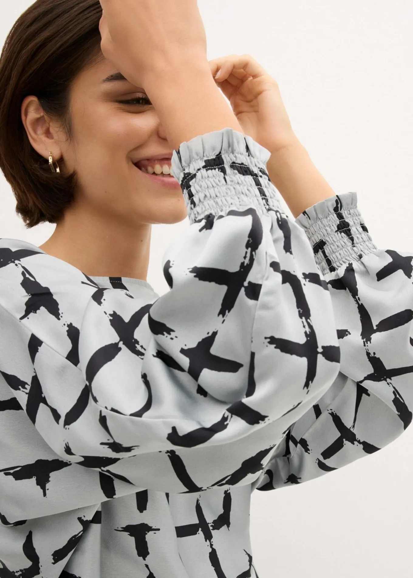 Blusa tipo túnica con mangas de murciélago
