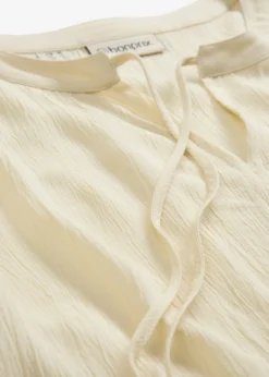 Blusa tipo túnica con mangas de murciélago