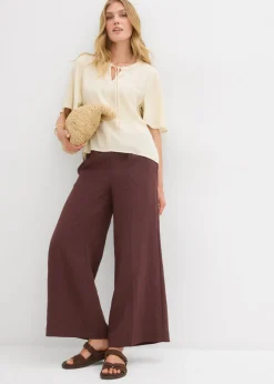 Blusa tipo túnica con mangas de murciélago