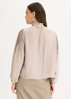 Blusa tipo túnica de satén brillante con ribetes