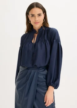 Blusa tipo túnica de satén brillante con ribetes