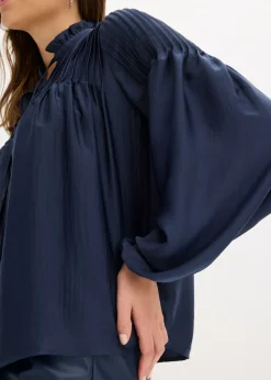 Blusa tipo túnica de satén brillante con ribetes