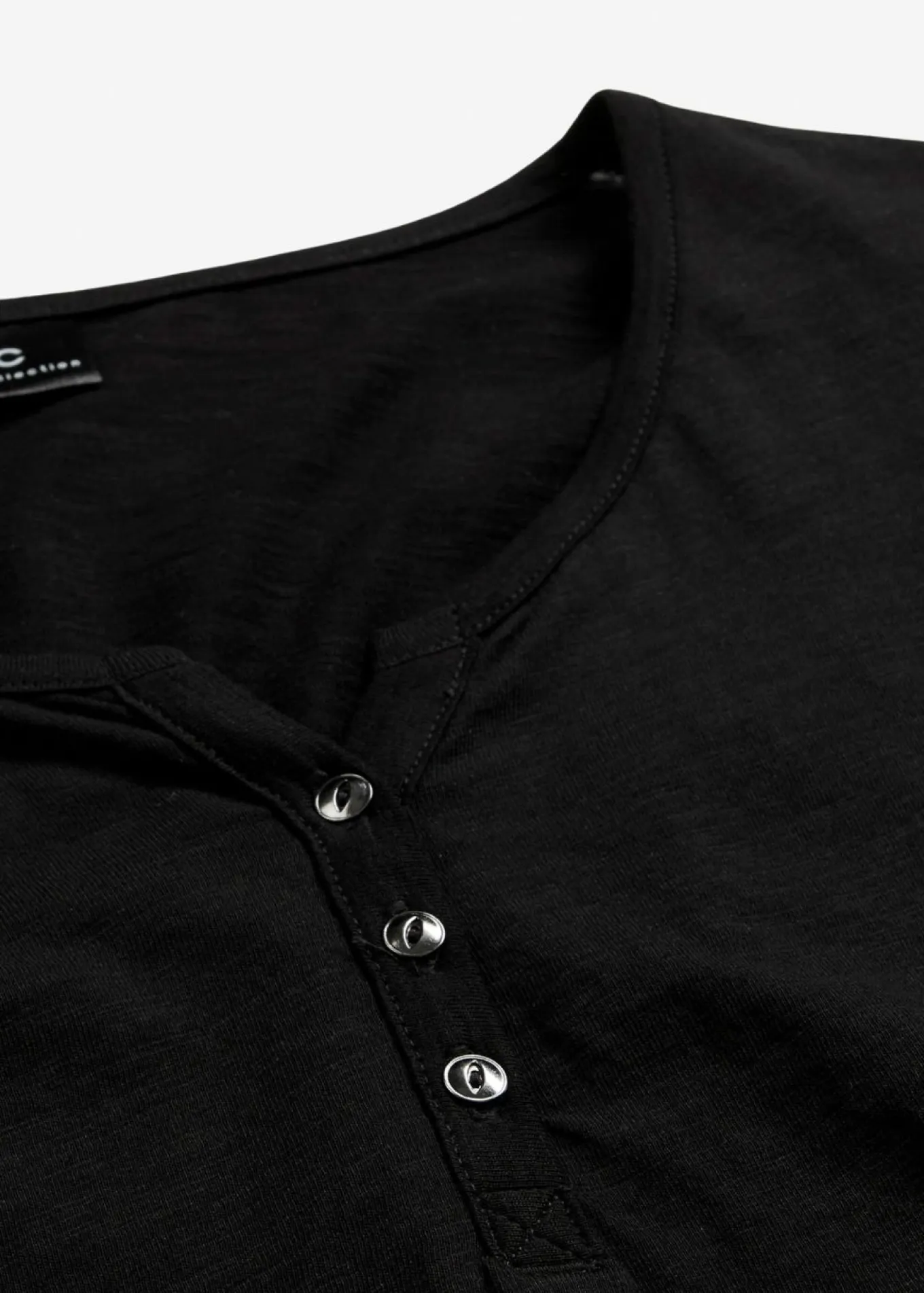 Camiseta de algodón orgánico puro con botones