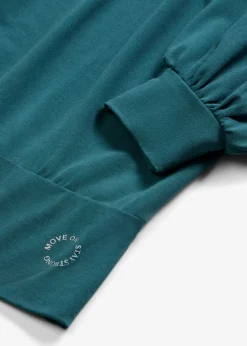 Camiseta deportiva con corte holgado, mangas ¾ y material de secado rápido