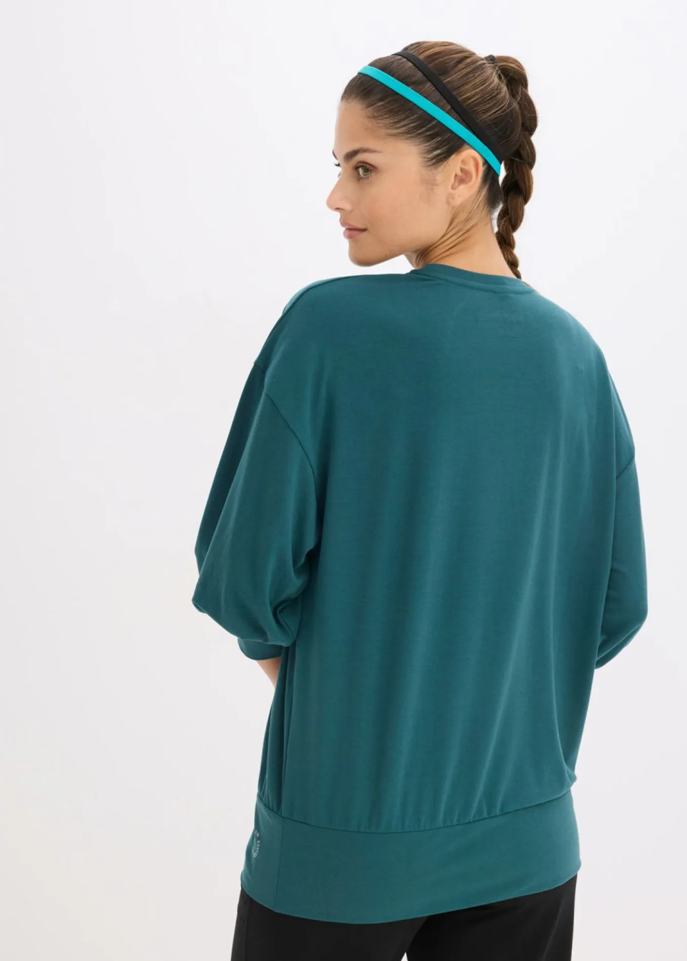 Camiseta deportiva con corte holgado, mangas ¾ y material de secado rápido