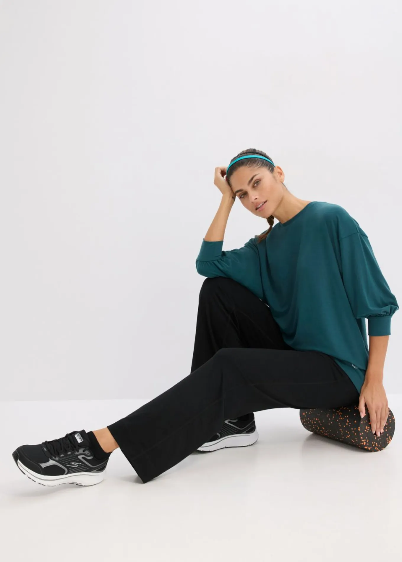 Camiseta deportiva con corte holgado, mangas ¾ y material de secado rápido