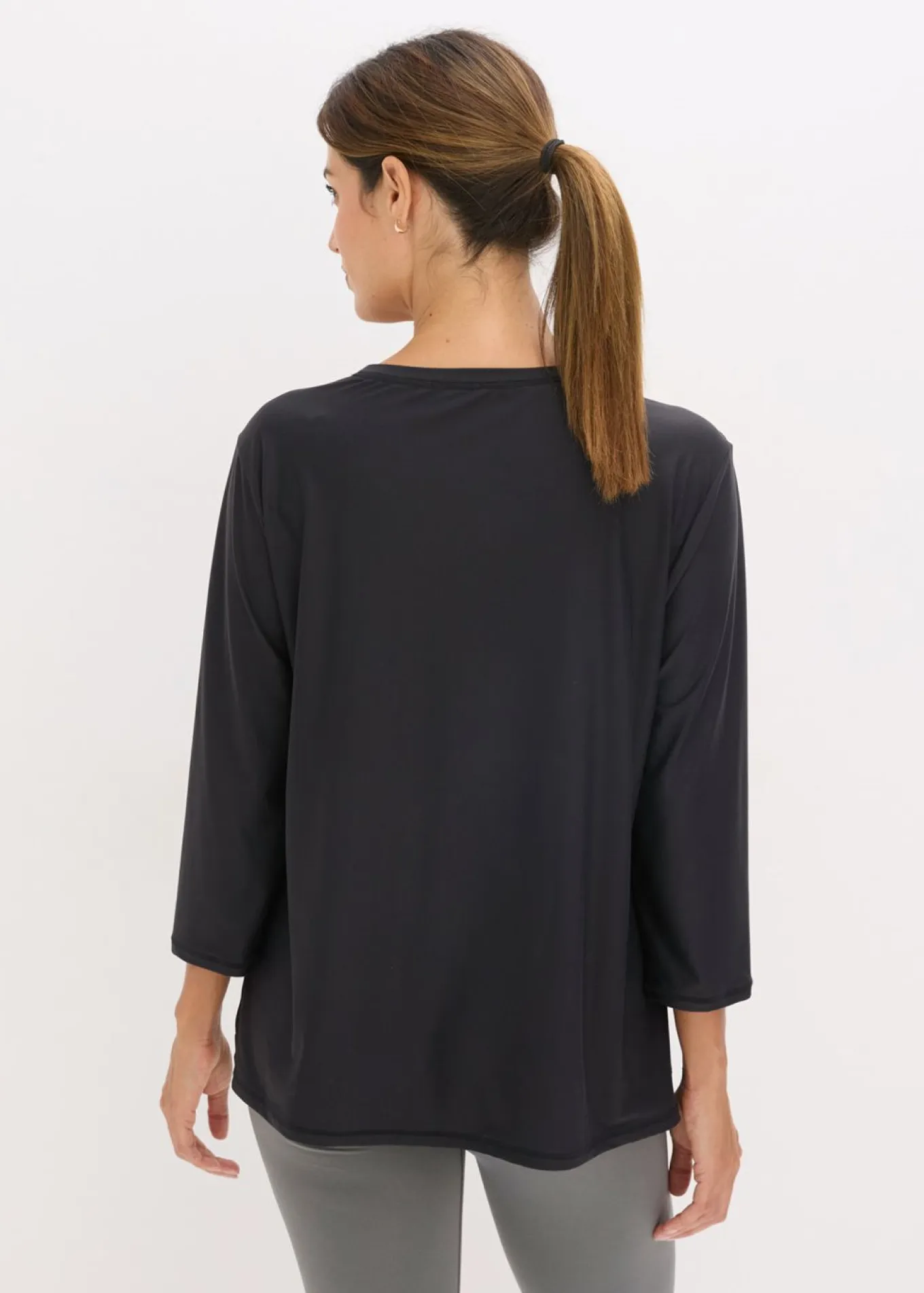 Camiseta funcional suave con mangas 3/4 y material de secado rápido