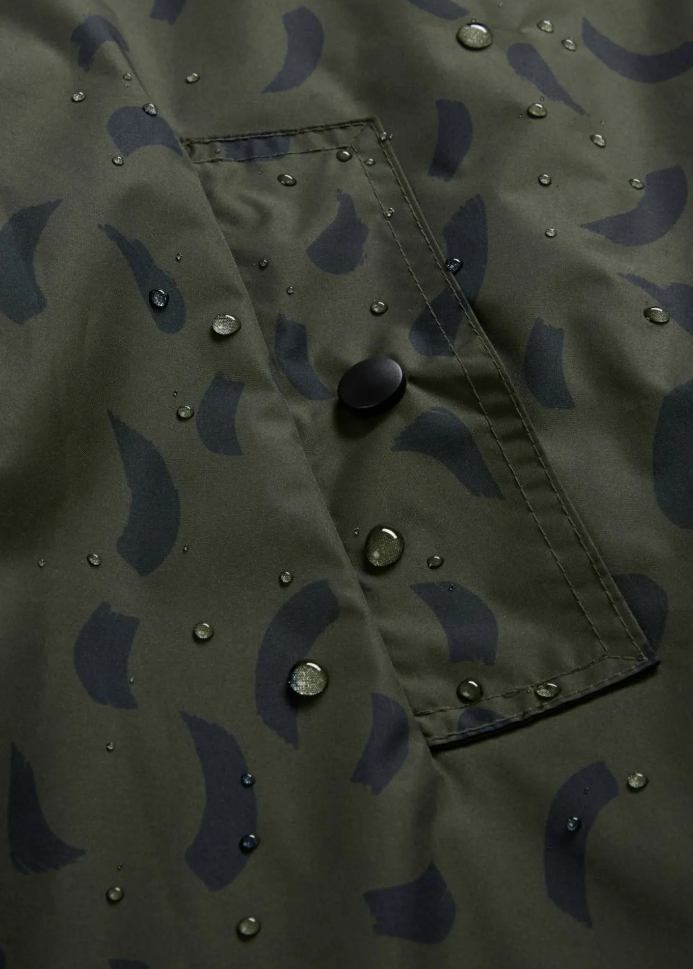 Capa impermeable premamá 3 en 1 con inserto de porteo y bolsa