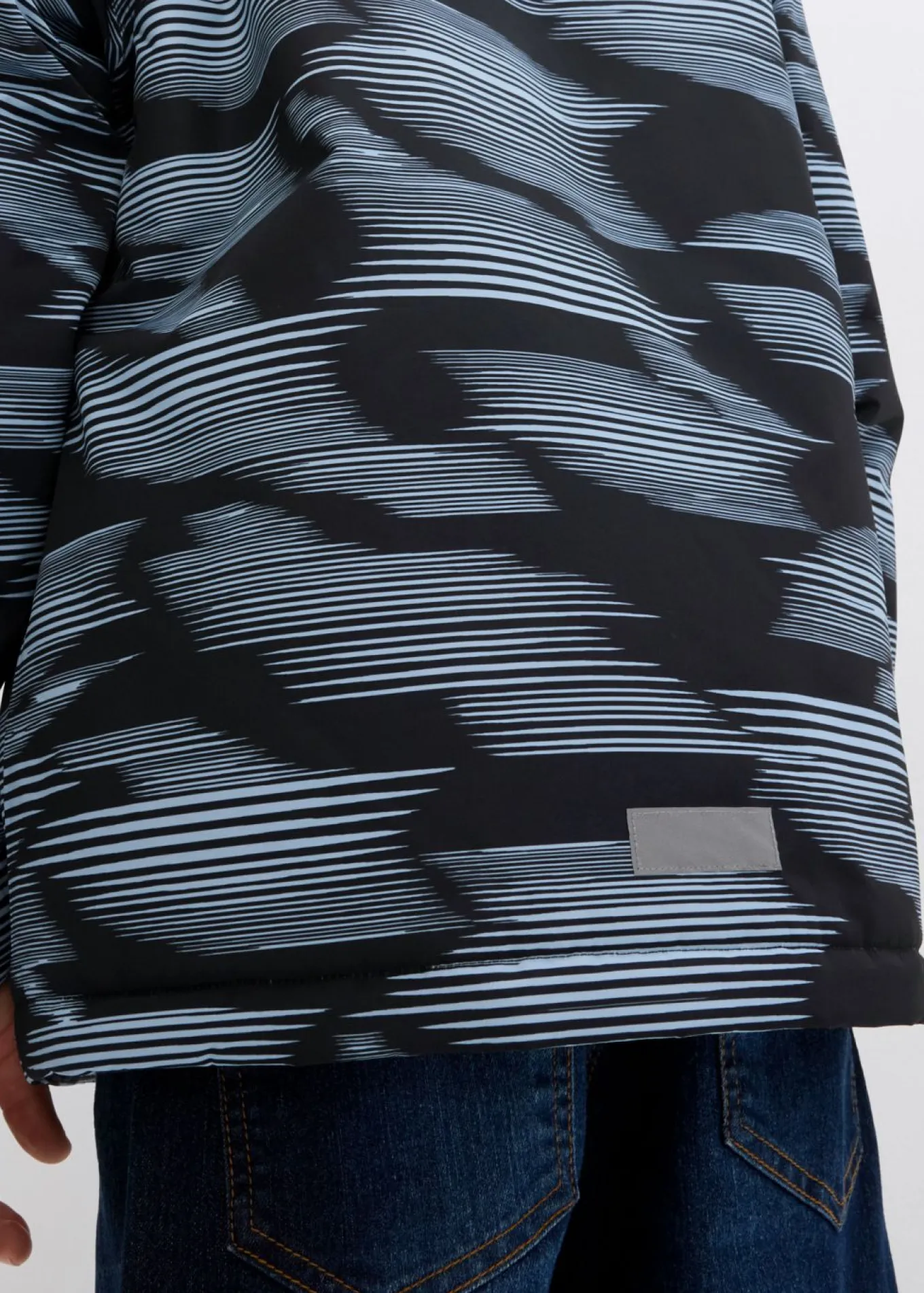 Chaqueta funcional impermeable con detalles reflectantes
