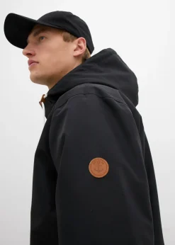 Chaqueta funcional impermeable con capucha y detalles de piel sintética