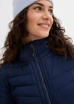 Chaqueta híbrida repelente al agua con inserciones acolchadas y de softshell