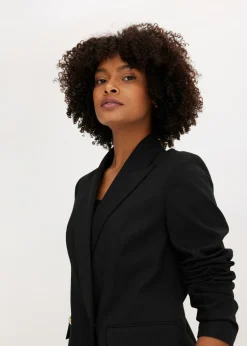 Chaqueta larga con botones decorativos
