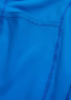 Cómodos leggings deportivos con bolsillo para móvil, corte acampanado y material de secado rápido