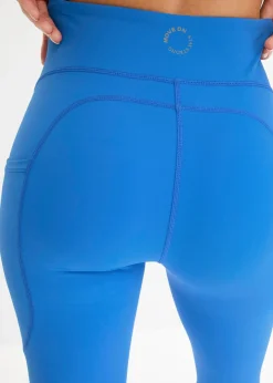 Cómodos leggings deportivos con bolsillo para móvil, corte acampanado y material de secado rápido