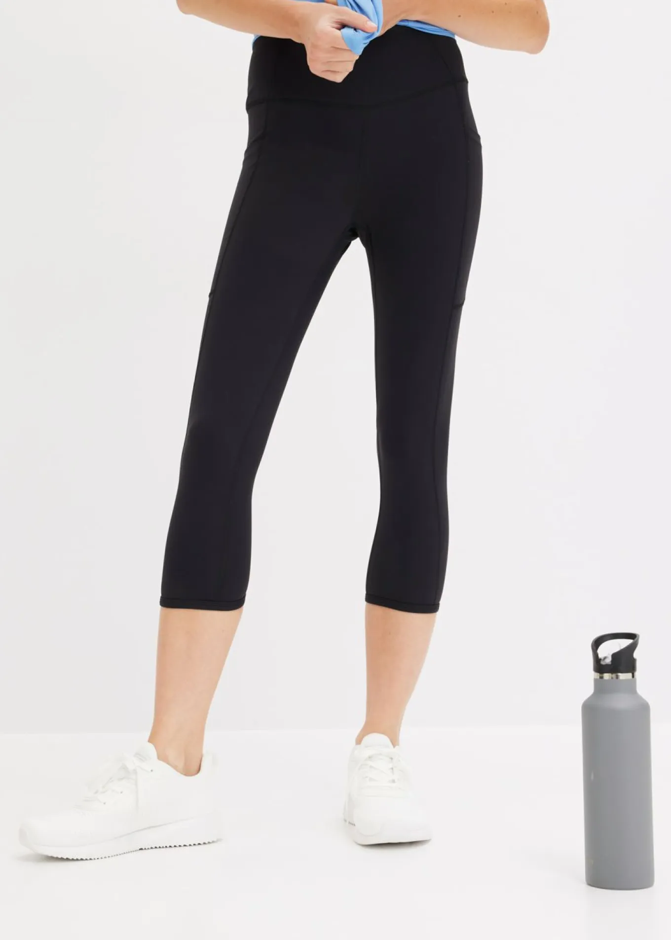 Cómodos leggings deportivos capri con bolsillo para móvil y material de secado rápido