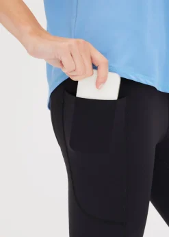 Cómodos leggings deportivos capri con bolsillo para móvil y material de secado rápido